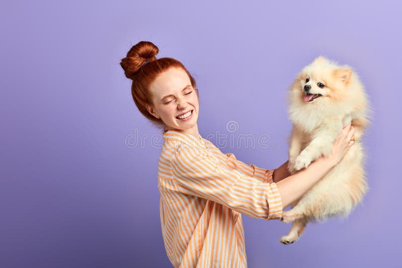 Angry frustrated girl holding her fluffy pet