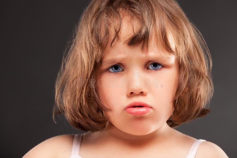 Angry little girl stock images