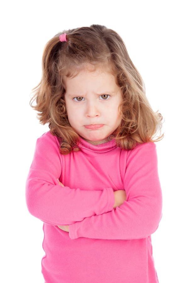 Angry little girl in pink isolated on a white background