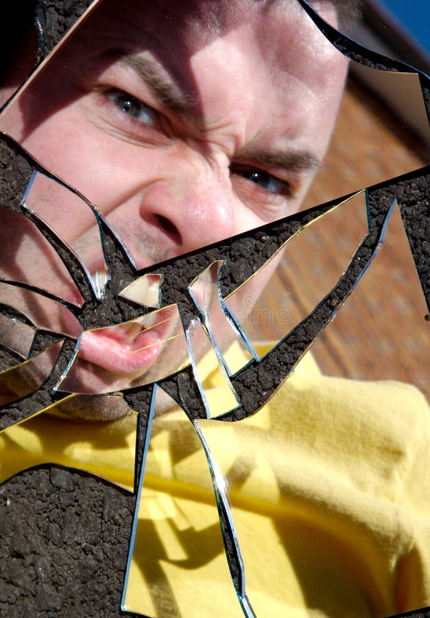 Angry Man in Broken Mirror stock image. Image of angry 22982483