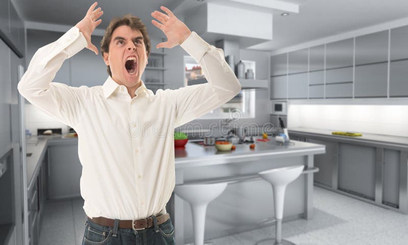 Angry man in the kitchen stock photo Angry man in the kitchen stock photo