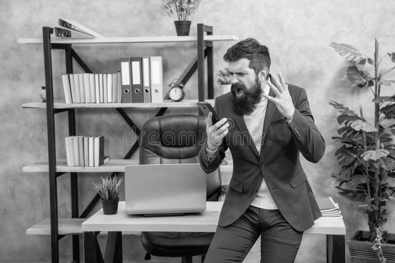 Angry manager screaming loud on mobile phone experiencing bad connection, video call stock image