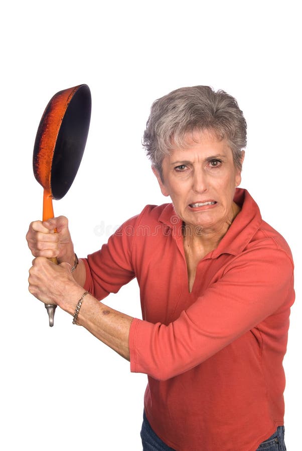 A mother gets ready to swing her frying pan in anger. Frying pan stock images, royalty-free photos and pictures