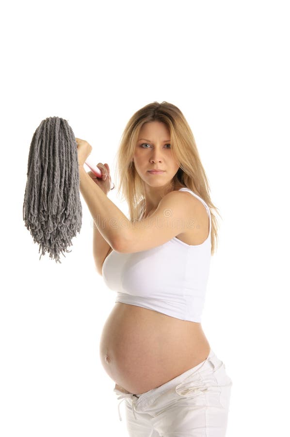 Angry pregnant woman with mop