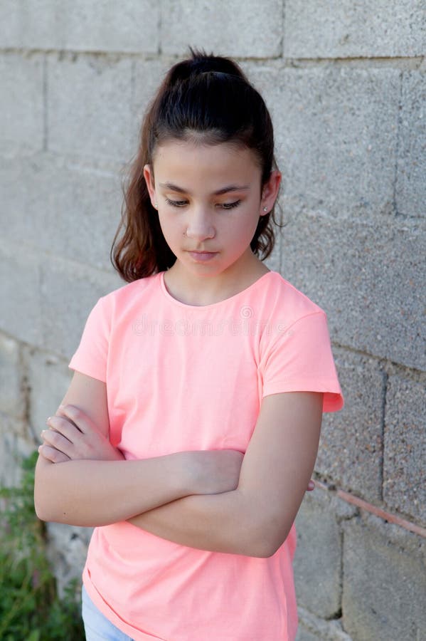 Angry preteen girl in the street stock image Angry preteen girl in the street stock image
