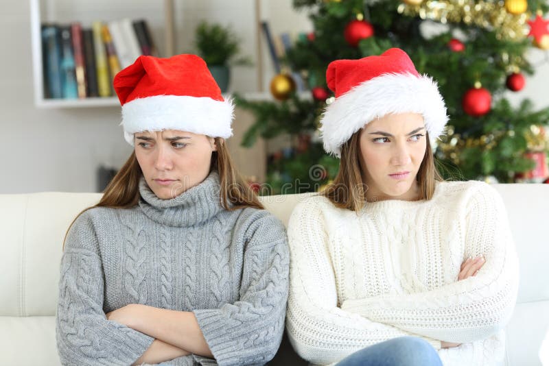 Angry roommates or sisters in christmas royalty free stock images Angry roommates or sisters in christmas royalty free stock images