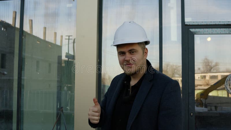Angry supervisor shouting at construction worker on a building site stock image