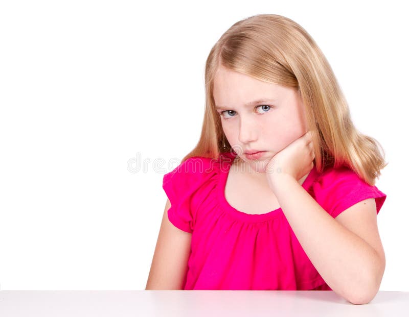 Angry or upset child or pre-teen isolated on white background