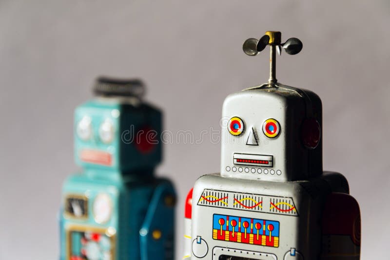 Angry vintage tin toy robots, artificial intelligence, robotic delivery concept stock photography Angry vintage tin toy robots, artificial intelligence, robotic delivery concept stock photography