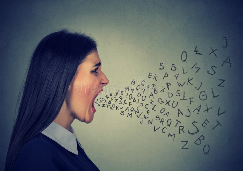 Side profile portrait of young angry woman screaming with alphabet letters flying out of wide open mouth on gray wall background. Side profile portrait of young angry woman screaming with alphabet letters flying out of wide open mouth on gray wall background