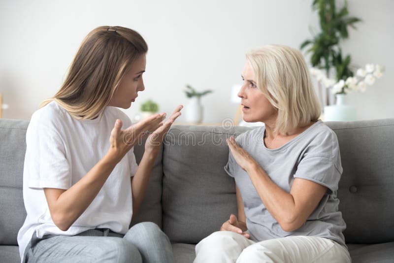 Angry young woman having disagreement with annoyed old mother
