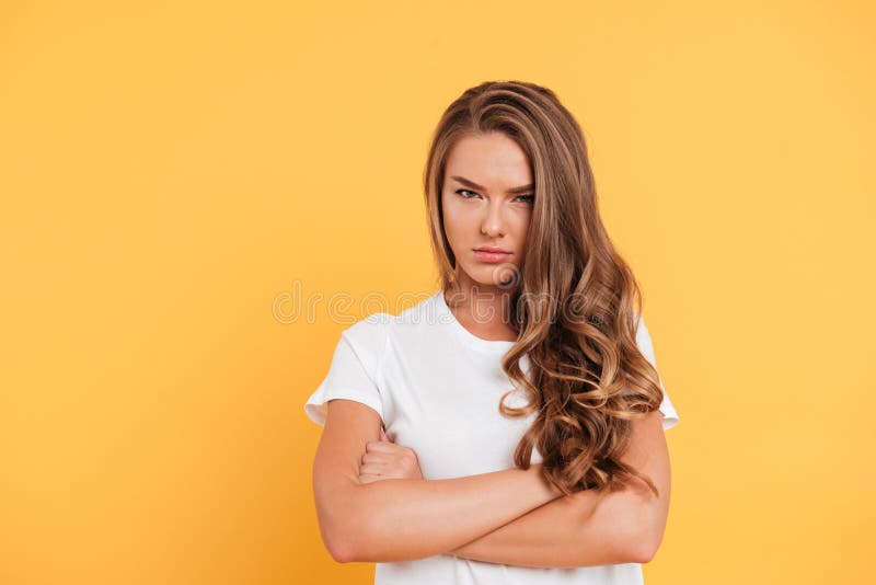 Cut Out Image Of A Young Seriously Looking Woman With Crossed Arms Stock  Photo, Picture and Royalty Free Image. Image 27574434.