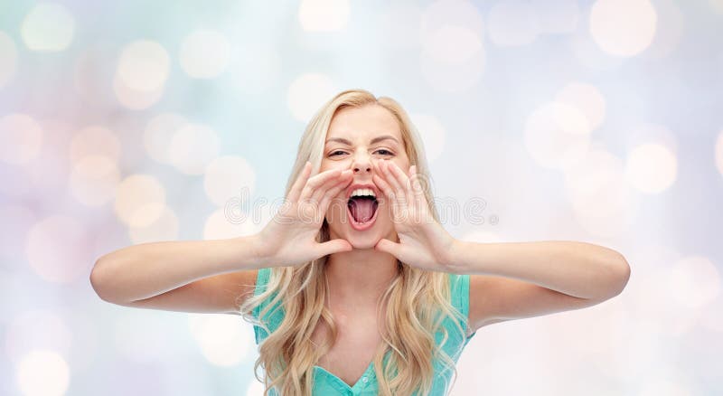 Angry young woman or teenage girl shouting.