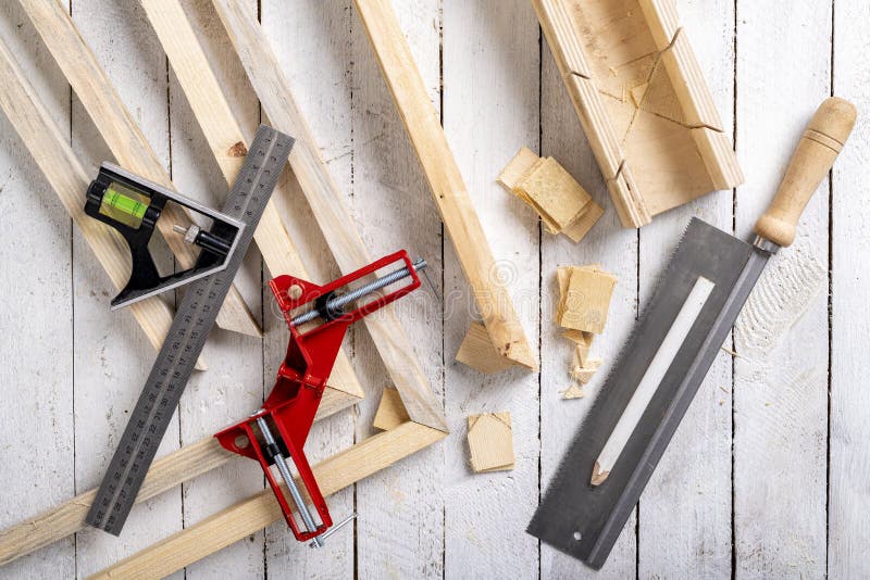 Angular connection of two pieces of wood. Making a wooden frame for a painting. stock image