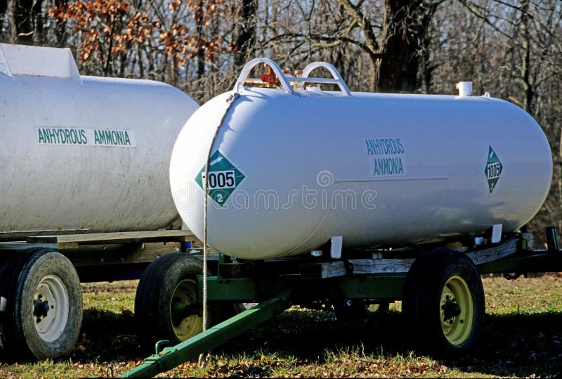 Anhydrous Ammonia nitrogen tanks in farm field, fertilizer for crops upstate rural New York. Anhydrous Ammonia nitrogen tanks in farm field, fertilizer for crops upstate rural New York