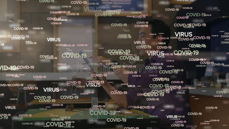 Animation of COVID-19 and VIRUS words moving over an Asian man working royalty free illustration