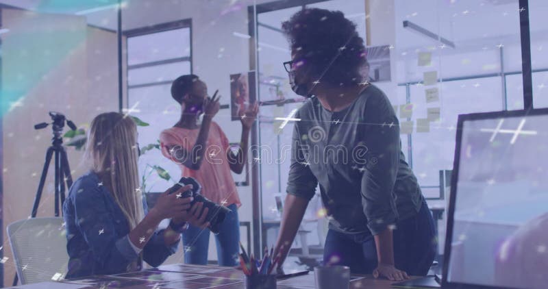 Animation of data processing over three diverse female colleagues in photography studio stock footage