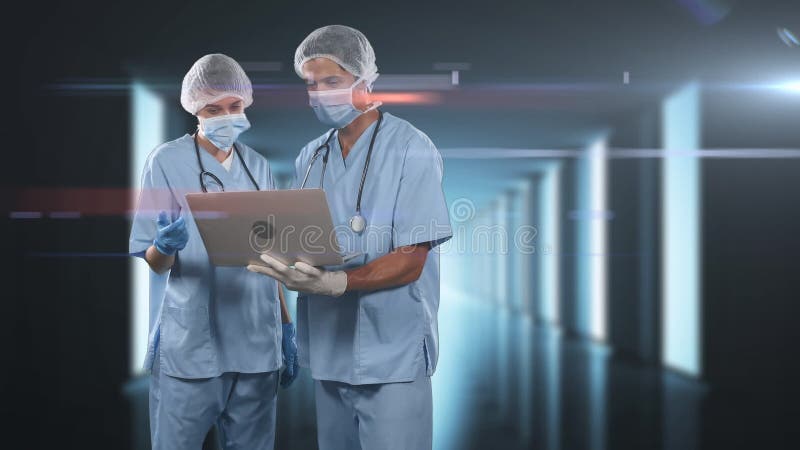 Animation de médecins portant des masques coronavirus covid19 et utilisant un ordinateur portable banque de vidéos
