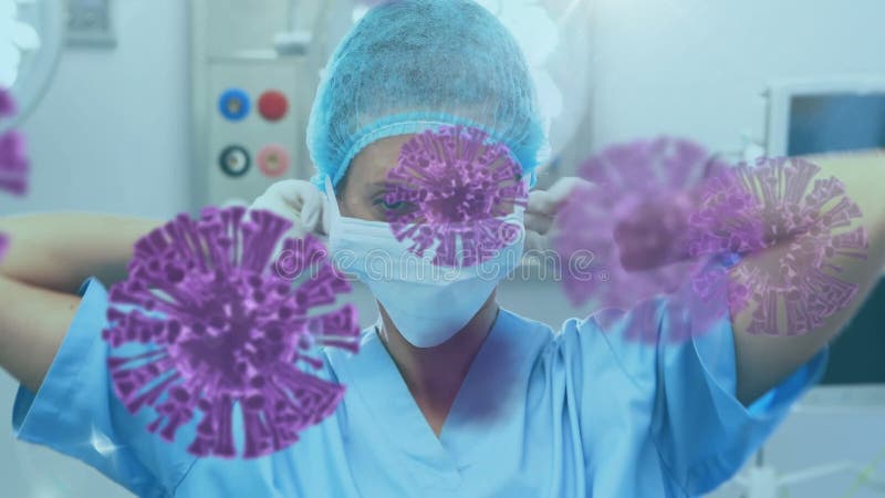 Animation des cellules macro covid19 flottant au-dessus du médecin féminin mettant sur un masque banque de vidéos