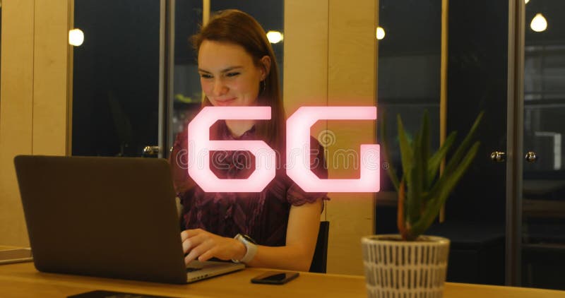 Animation of 6g text over caucasian businesswoman using laptop stock footage