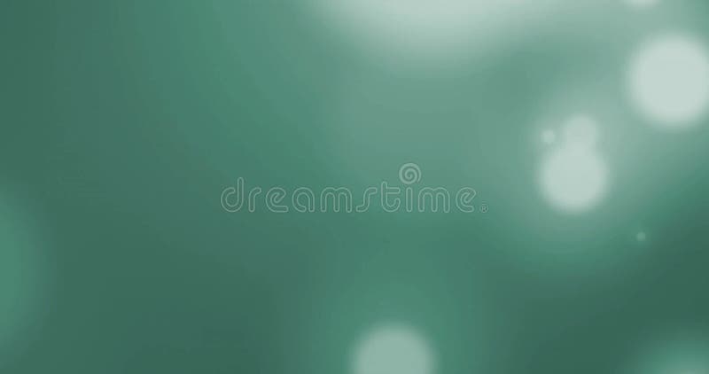 Animation of light spots on green background stock footage