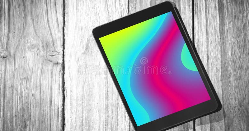 Animering av tabletter med färgstarka rörliga former på skärmen på träbakgrund