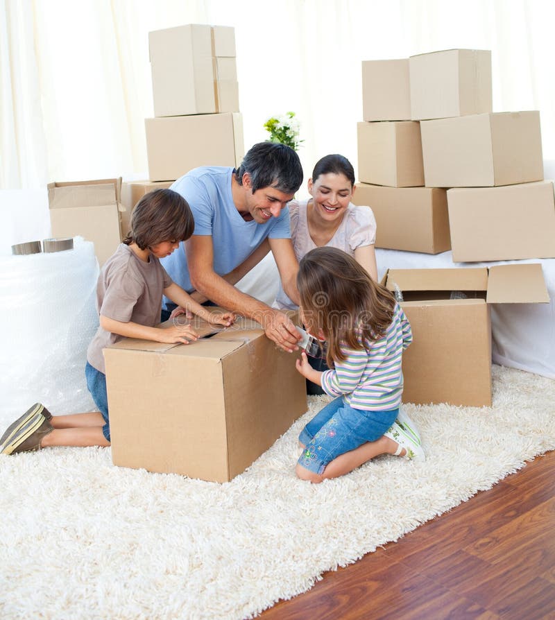 Animated family packing boxes while moving house. Animated family packing boxes while moving house