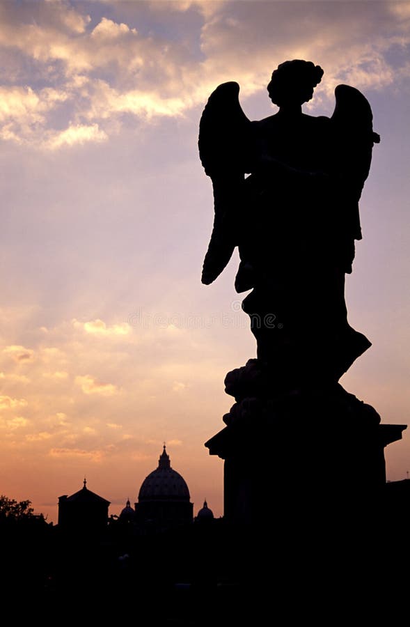 Angel silhouetted on Pont Sant'Angelo in Rome. Angel silhouetted on Pont Sant'Angelo in Rome