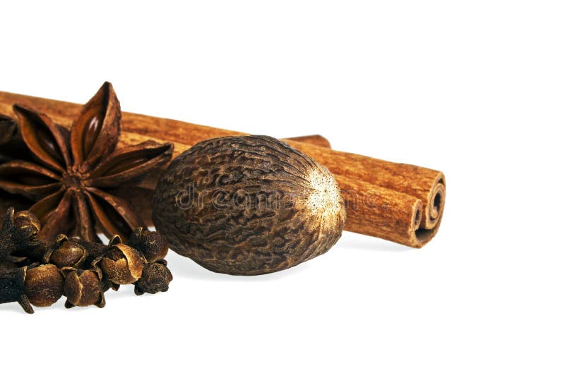 Anise, Cloves, Nutmeg and Cinnamon Sticks on a White Background. Stock