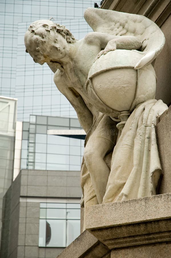 Monument in columbus circle in New York City with modern building on the background. Monument in columbus circle in New York City with modern building on the background