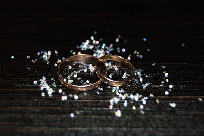 Two wedding rings on a background of rhinestones. Two wedding rings on a background of rhinestones