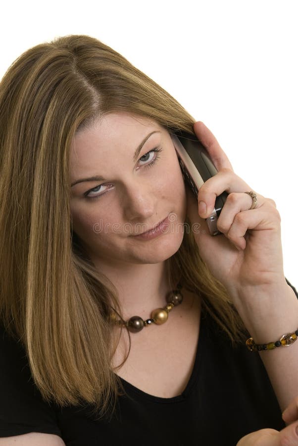 Attractive Caucasian woman with annoyed expression on the phone. Attractive Caucasian woman with annoyed expression on the phone.