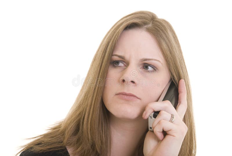 Attractive Caucasian woman with annoyed expression on the phone. Attractive Caucasian woman with annoyed expression on the phone.