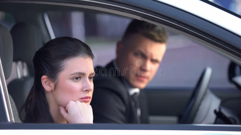 Annoyed women looking out of car window, upset after quarrel with man, divorce, stock photo. Annoyed women looking out of car window, upset after quarrel with man, divorce, stock photo