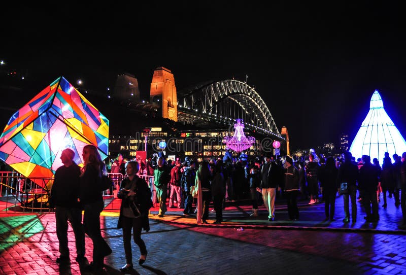 An annual outdoor lighting festival with immersive light installations and projections `Vivid Sydney` near The harbour bridge.