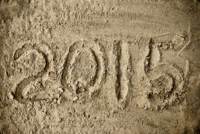 Année 2015 manuscrite sur le sable de plage images stock Année 2015 manuscrite sur le sable de plage images stock