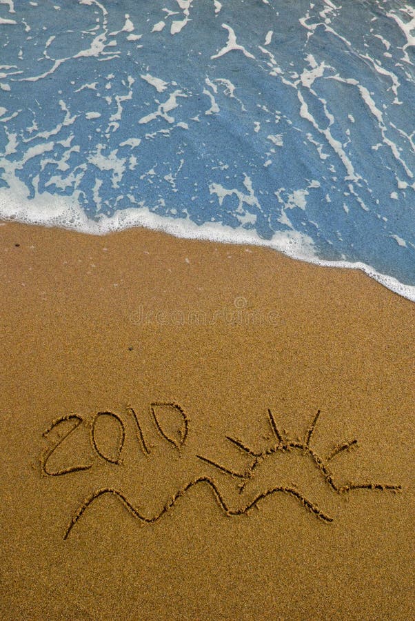 Year 2010 written on the sand. Year 2010 written on the sand