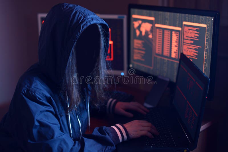 Anonymous hacker girl with no face typing the code tries to hack the system on the background screens in neon light royalty free stock photography Anonymous hacker girl with no face typing the code tries to hack the system on the background screens in neon light royalty free stock photography