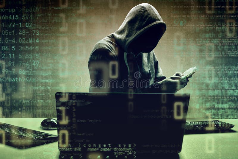 Anonymous Hacker in Front of Computer. Crime Concept Stock
