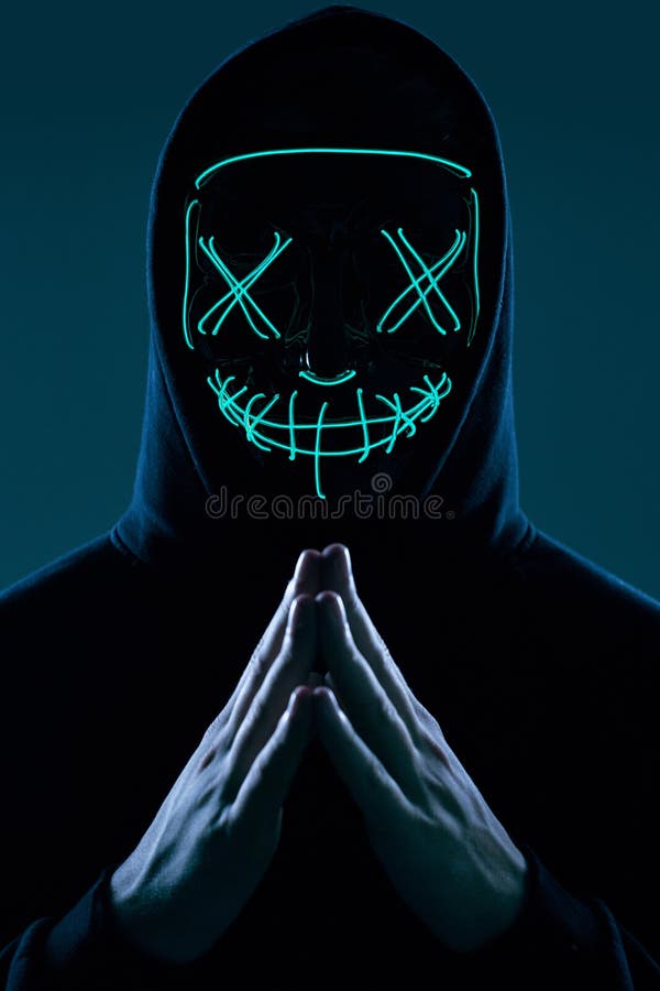 Anonymous Man In Black Hoodie Hiding His Face Behind A Neon Mask Stock Image Image Of Dark 