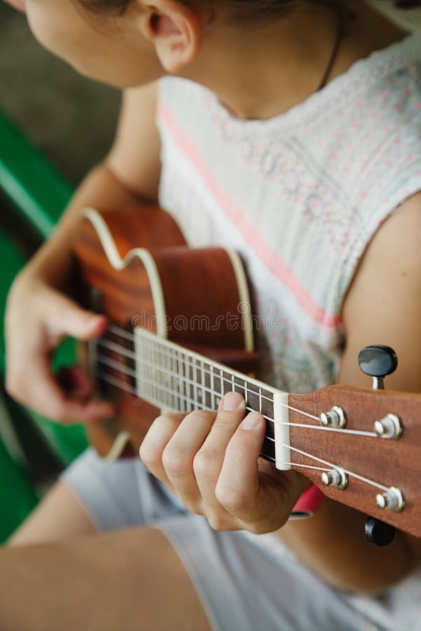 Anonymous woman playing ukulele stock photos