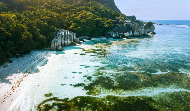 Anse Source d`Argent beach at La Digue island, Seychelles in the morning light. Aerial View. Anse Source d`Argent beach at La Digue island, Seychelles in the morning light. Aerial View.