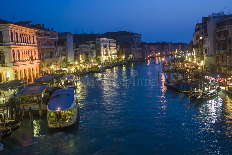 VENICE, ITALY - APRIL 7, 2007: view to Canale Grande by night in Venice, Italy. Canale Grande is 3800 m long, 30â€“90 m wide, with an average depth of five meters. VENICE, ITALY - APRIL 7, 2007: view to Canale Grande by night in Venice, Italy. Canale Grande is 3800 m long, 30â€“90 m wide, with an average depth of five meters.