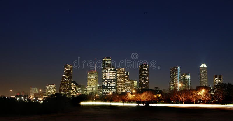 View on Downtown - Dark Night in Houston, Texas. Allen Parkway in the foreground. View on Downtown - Dark Night in Houston, Texas. Allen Parkway in the foreground.