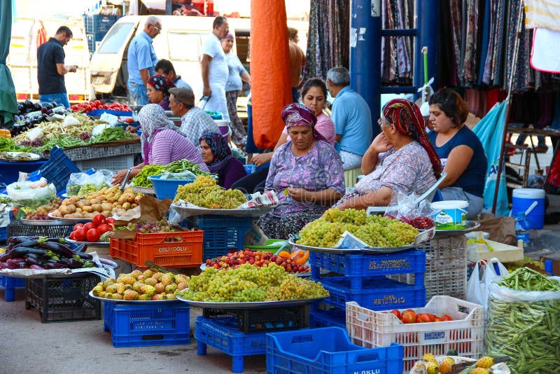 ANTALYA, TURKEY - Aug 14 2012, View of a traditional street markets where old and young women selling fruit and vegetables and tal