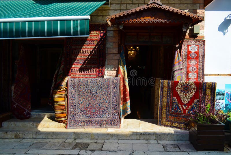 Antalya, Turkey, May 10.05.2018. Enter in a Store carpets and old things in the easten town stock photography Antalya, Turkey, May 10.05.2018. Enter in a Store carpets and old things in the easten town stock photography