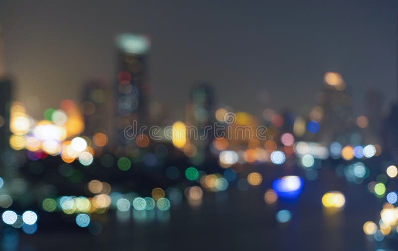 Antecedentes de los edificios de rascacielos en el centro Ciudad urbana con luces, foto borrosa por la noche paisaje urbano ilumi