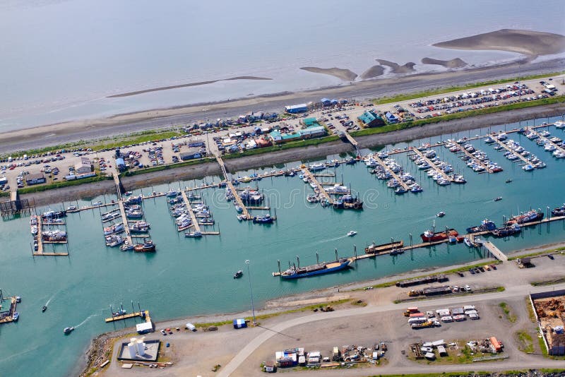 An aerial view of the world famous Homer Spit and the Small Boat Harbor. A common summer cruise ship port of call, located on the very end of the Kenai Peninsula and part of the Pacific Ocean Ring of Fire, Homer is famous for commercial and recreational fishing, particularly halibut, outdoor recreation opportunities, and its eclectic artist vibe is popular with both Alaskans and tourists alike. An aerial view of the world famous Homer Spit and the Small Boat Harbor. A common summer cruise ship port of call, located on the very end of the Kenai Peninsula and part of the Pacific Ocean Ring of Fire, Homer is famous for commercial and recreational fishing, particularly halibut, outdoor recreation opportunities, and its eclectic artist vibe is popular with both Alaskans and tourists alike.