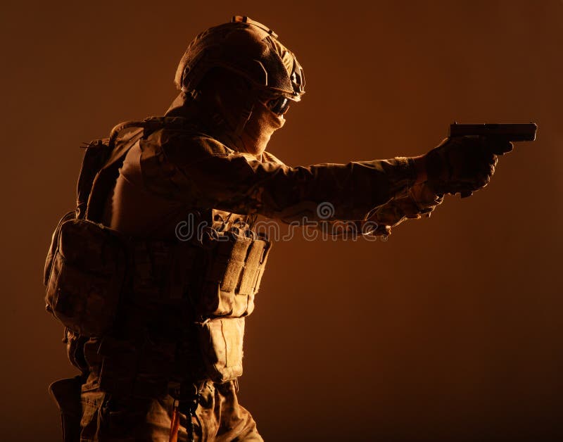Anti terrorist squad fighter aiming with pistol stock photography Anti terrorist squad fighter aiming with pistol stock photography