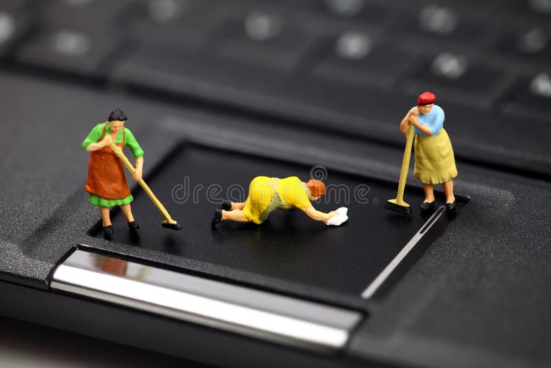 Miniature maids or cleaning women on a laptop computer. They are cleaning viruses, spyware and trojans. Computer anti-virus and security concept. Miniature maids or cleaning women on a laptop computer. They are cleaning viruses, spyware and trojans. Computer anti-virus and security concept.